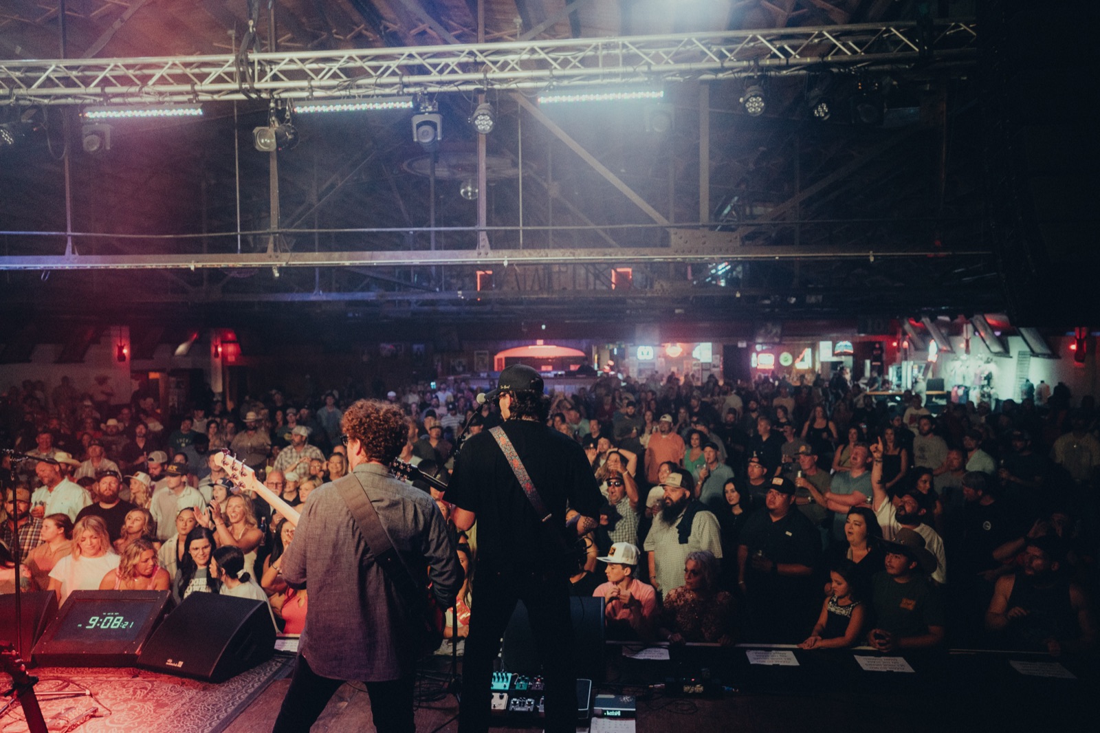 View from the stage over a full dance hall crowd
